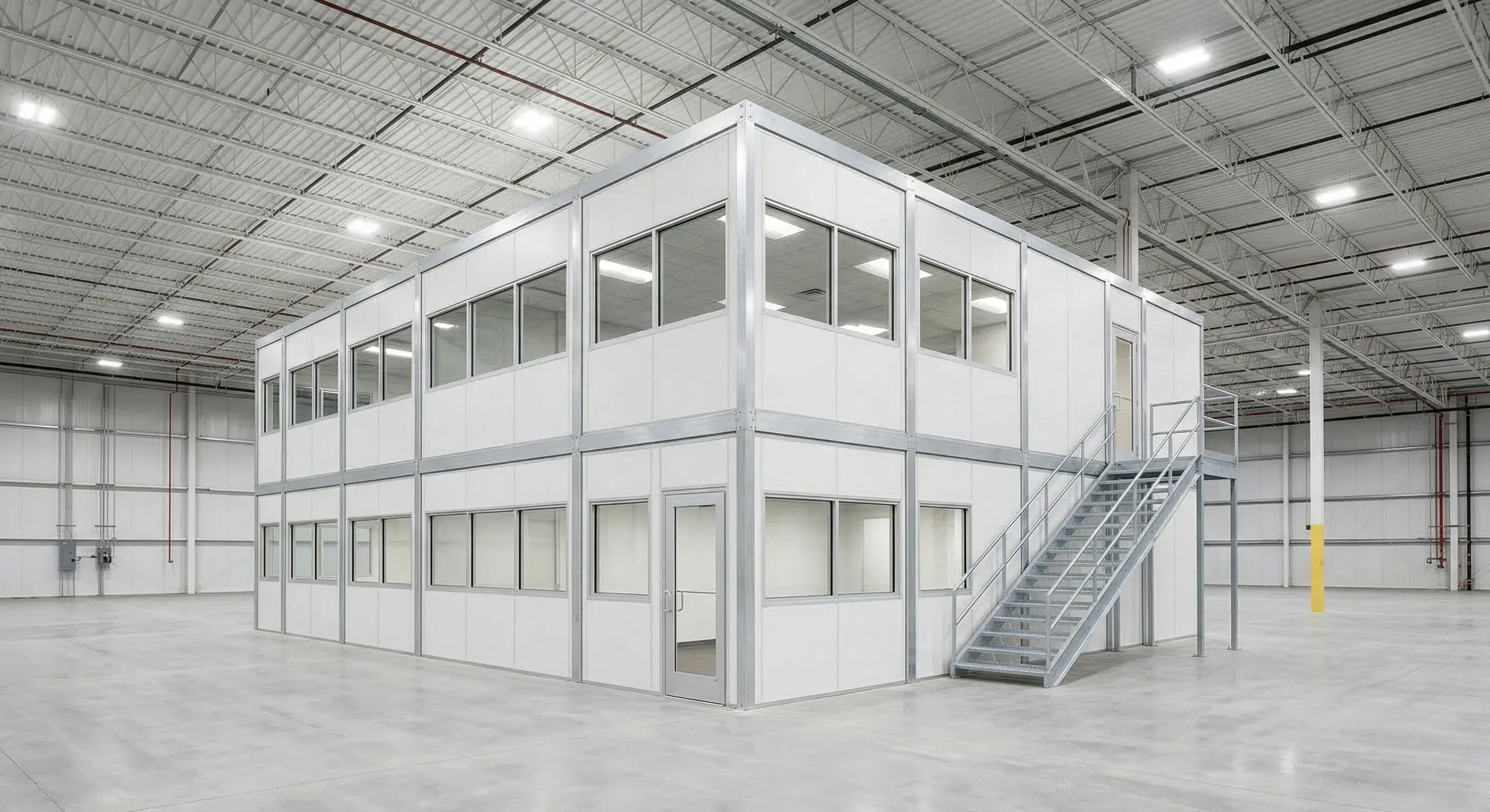 Two-story in-plant modular office with staircase installed inside a Baltimore area warehouse